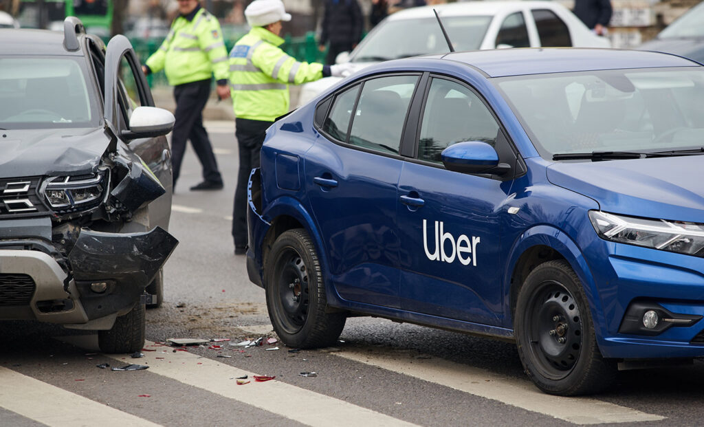 A blue car with visible damage after an accident, symbolizing "personal injury" - Cobb Personal Injury